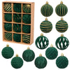 A set of twelve dark green velvet Christmas hanging ornaments with gold striped accents displayed in a cardboard box.