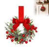A 10-inch artificial Christmas wreath decorated with green foliage, red berries, and a large red velvet bow.