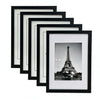 A set of five black and white photo frames in varying sizes, displaying the Eiffel Tower.