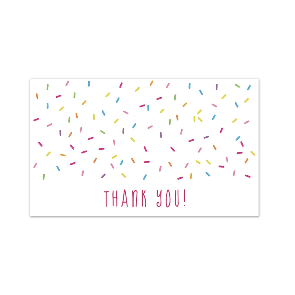 A white card with colorful confetti scattered across it and the text THANK YOU!