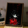 A framed poster featuring a red spider lily with white accents against a black background.