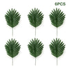 Six artificial tropical palm leaves in various shades of green displayed individually.