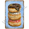 A plaque featuring a painting of three glazed donuts on a blue background.