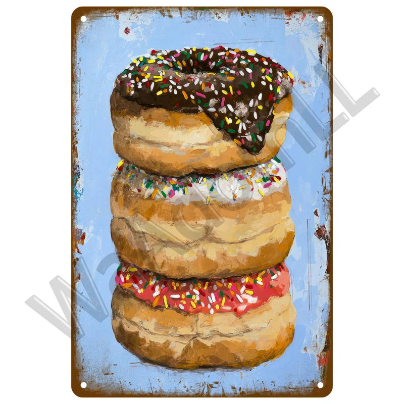 A plaque featuring a painting of three glazed donuts on a blue background.