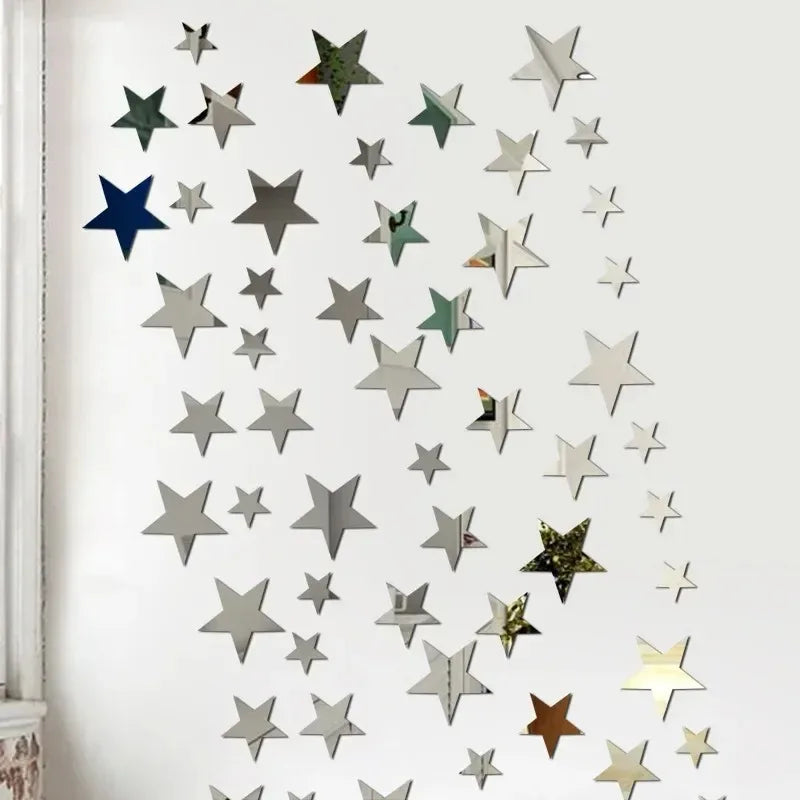 A collection of silver and green star-shaped acrylic mirror wall decor pieces arranged in a diagonal pattern.