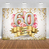 A photo booth backdrop featuring large gold and silver balloons spelling 60 and pink roses with gold streamers.