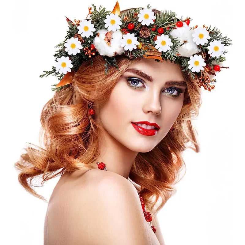 A woman wearing a floral crown made of artificial sunflowers and daisies with red berries and white fluff.