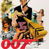 A vintage cinema art poster featuring a man in a suit holding a gun and a woman, with the title 007 prominently displayed.