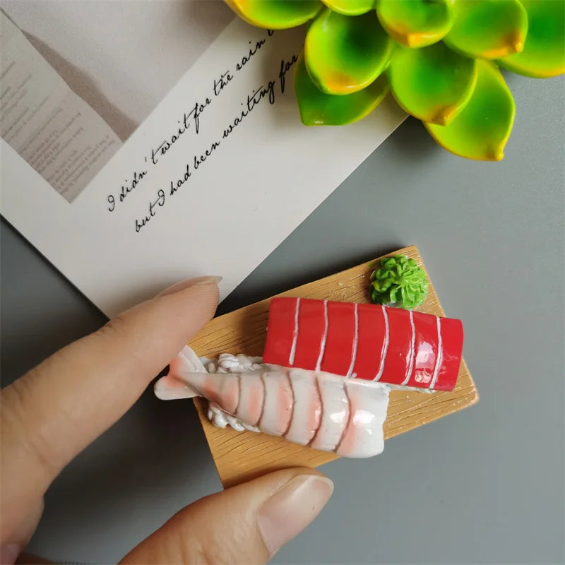 A hand holds a wooden serving board with sliced pink and white food-shaped magnets, including a red slice.