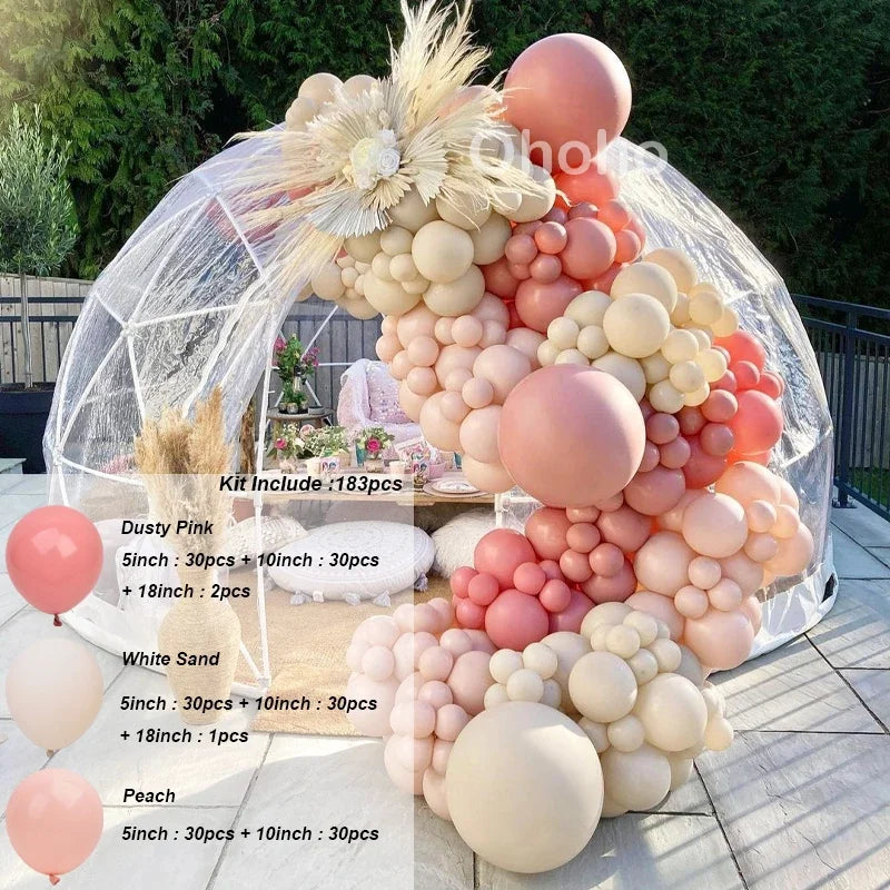 A kit of pink and beige balloons arranged in an arch or garland display.