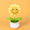Hand woven crochet yellow sunflower plant in a white pot