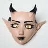 A realistic fantasy creature mask with black horns and detailed facial features.