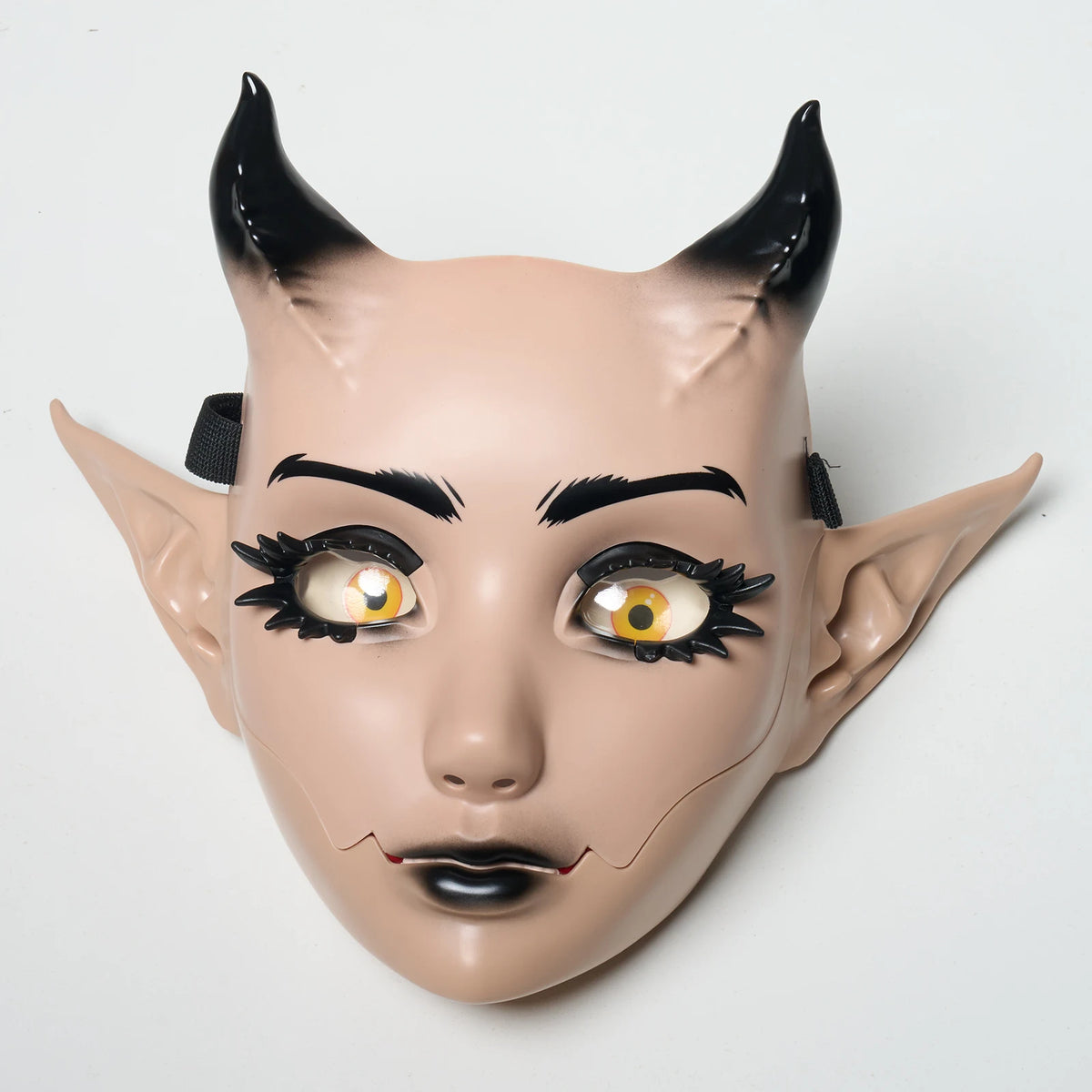 A realistic fantasy creature mask with black horns and detailed facial features.