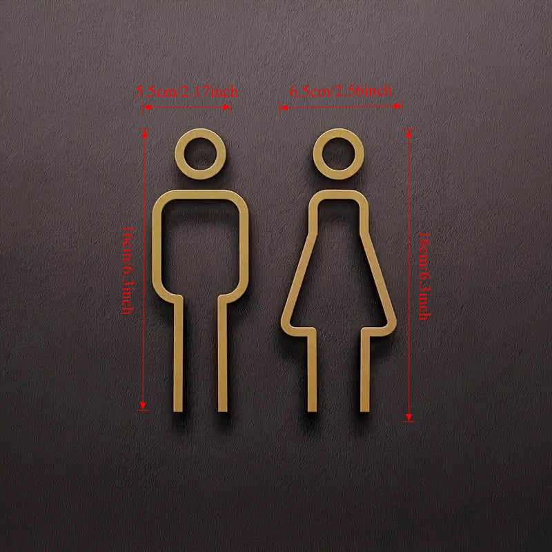Deux panneaux de porte en bois montrant des silhouettes masculines et féminines avec leurs mesures correspondantes.