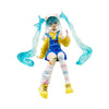 A PVC collectible figurine of Hatsune Miku with long blue hair and a yellow outfit.