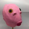 A pink, textured realistic horror animal mask with large black eyes and a snout.