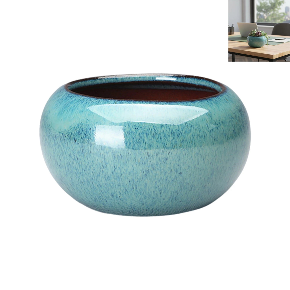 Maceta de suculenta de cerámica redonda con esmalte azul moteado y borde marrón sin esmaltar.