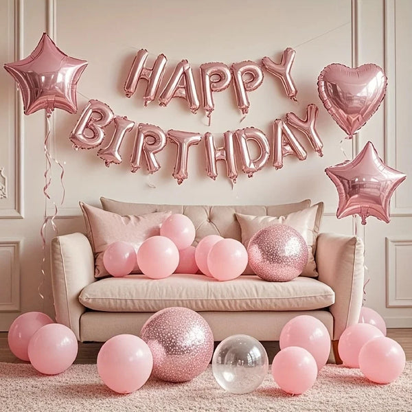 Pink marble birthday balloon decoration set featuring a banner and balloons on a light pink rug.