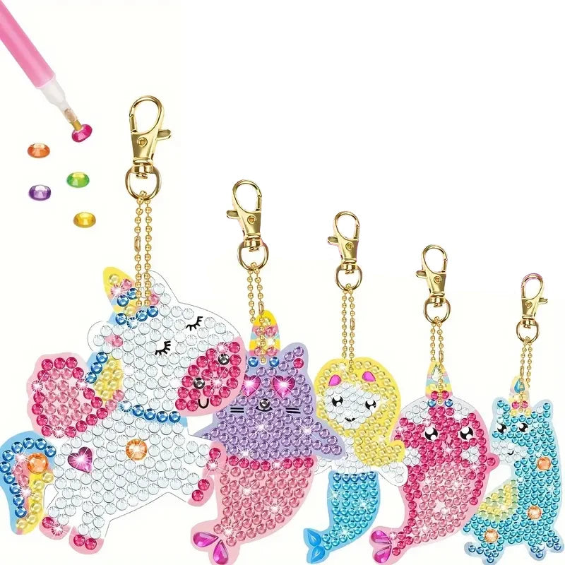 A collection of DIY diamond painting keychains featuring cute animal designs in various colors and glitter.