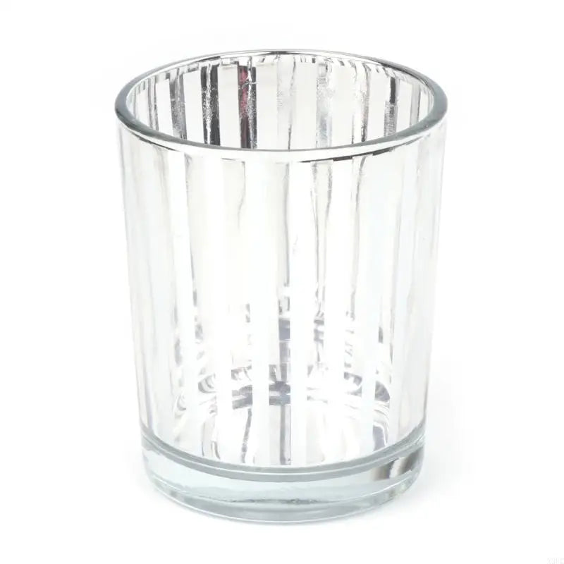 A clear glass votive candle holder with vertical ribbed texture.
