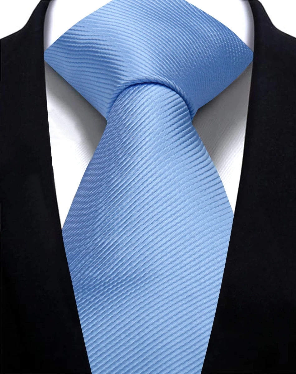 A light blue silk necktie tied in a knot against a black suit jacket.
