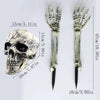 A pair of realistic skeleton arm stakes, measuring 13cm long and featuring detailed skeletal hands and wrists.