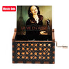 A carved wooden music box featuring a photograph of Marion Cotillard in a dark setting.