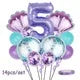 A set of 14 mermaid-themed balloons in shades of purple and teal for a party decoration.