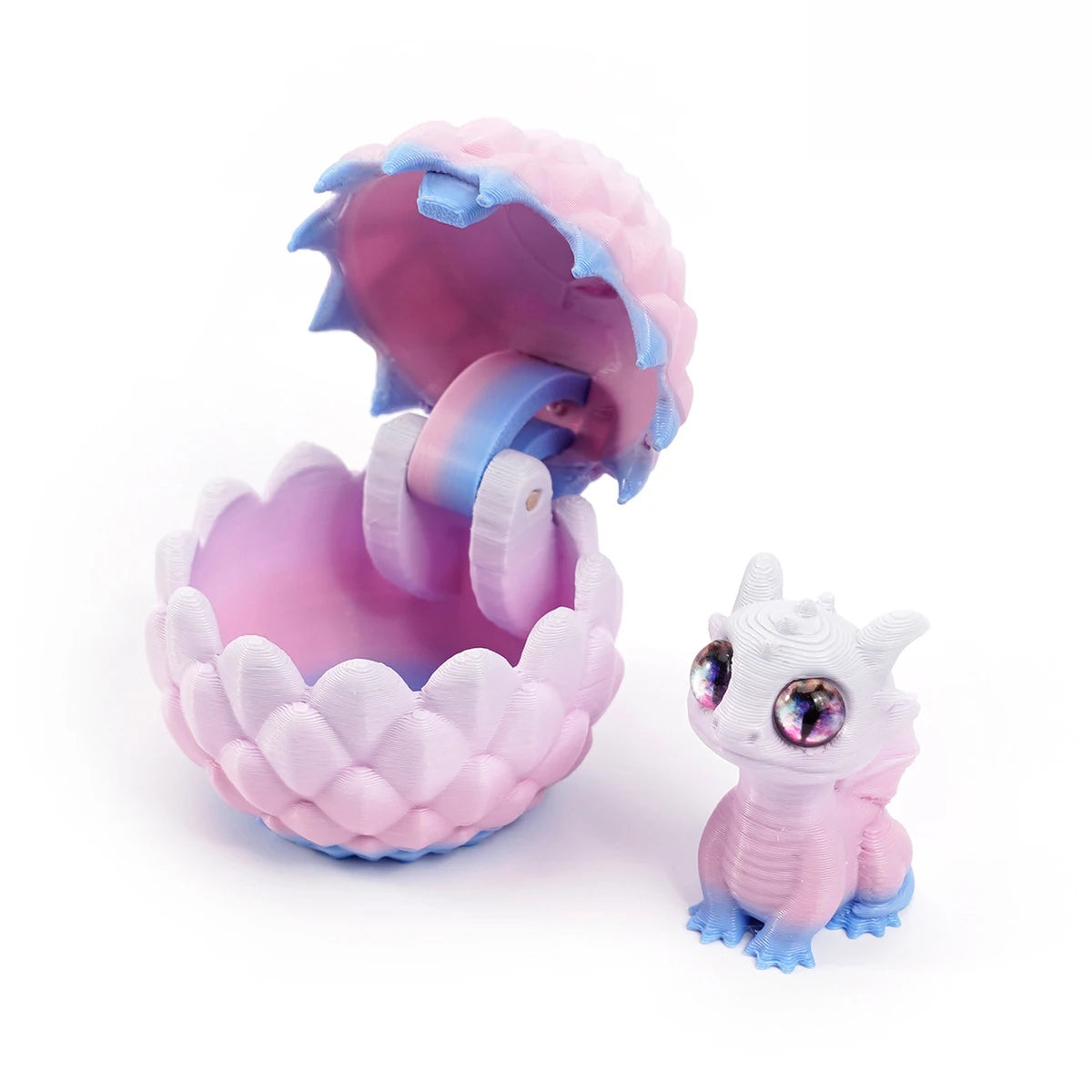 A pink dragon egg is cracked open, revealing a small, light purple and blue dragon toy inside.