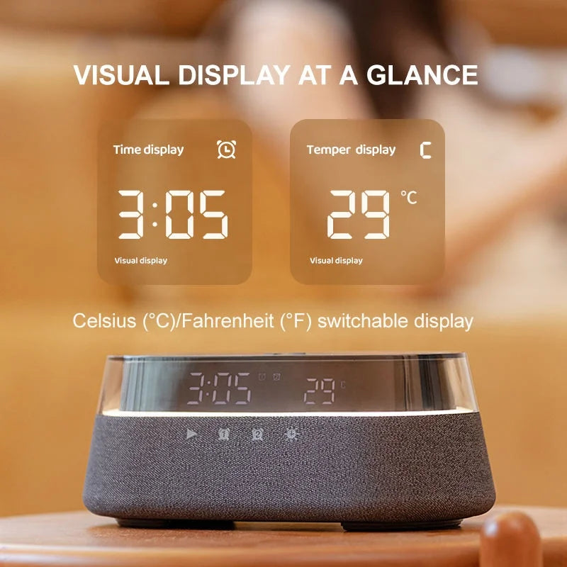 A dark gray wireless charging speaker lamp displaying time and temperature on its front panel.