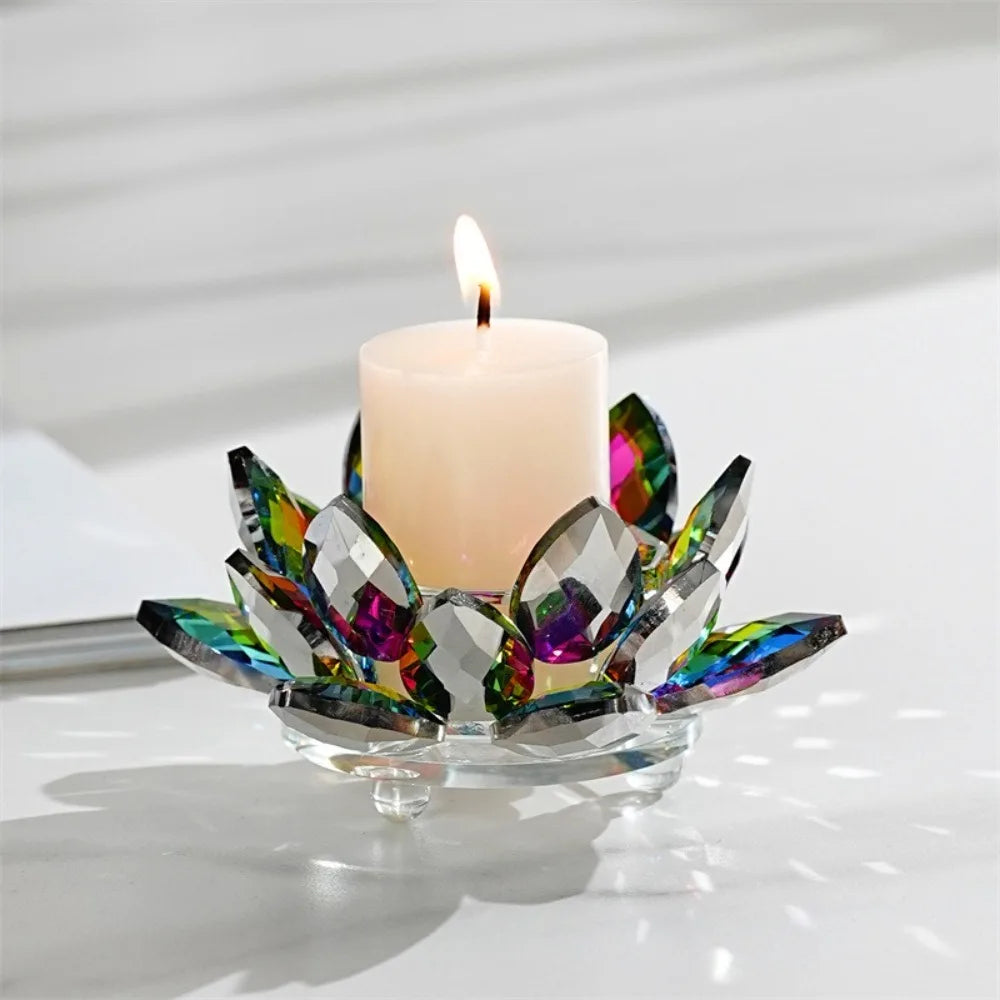 A crystal lotus candle holder with iridescent glass petals and a white candle flame.
