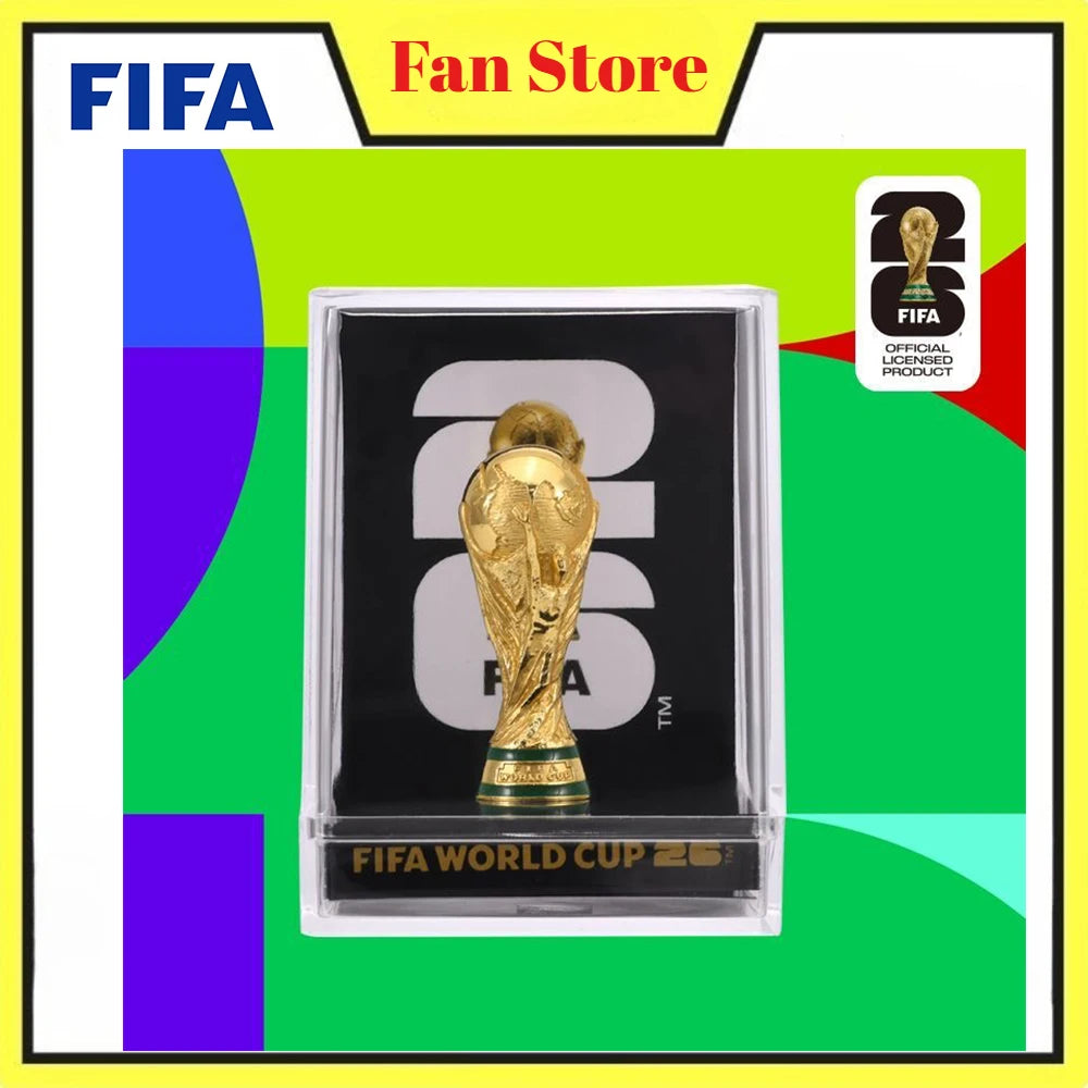A display box featuring a gold-colored FIFA World Cup 2026 trophy figurine.