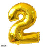 A shiny gold foil balloon shaped like the number 2