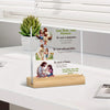 A clear acrylic desktop statue featuring a biblical scene with text about God and faith, displayed on a wooden base.