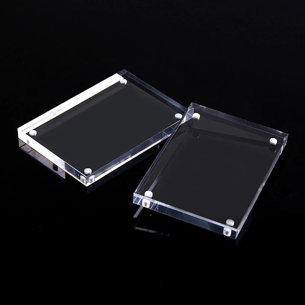 Two clear acrylic magnetic photo frames displayed on a black background.