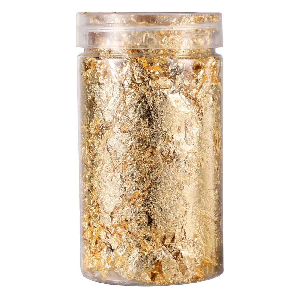 A clear jar filled with shiny gold foil flakes for resin art and jewelry making