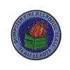 An enamel pin featuring a green dumpster with flames on top, surrounded by text reading DUMPSTER FIRE RESPONSE TEAM LEADER.