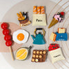 A collection of 3D resin food magnets featuring various foods like pain, egg, ice cream, and tomato.