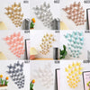 A set of 3D hollow butterfly wall decals in various gold, silver, and light blue colors.
