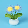 Hand woven crochet blue and yellow flowers in a white pot