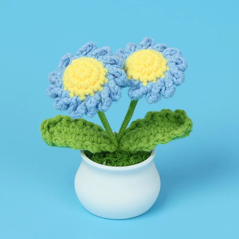 Hand woven crochet blue and yellow flowers in a white pot