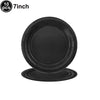 A stack of ten 7-inch black disposable paper plates.