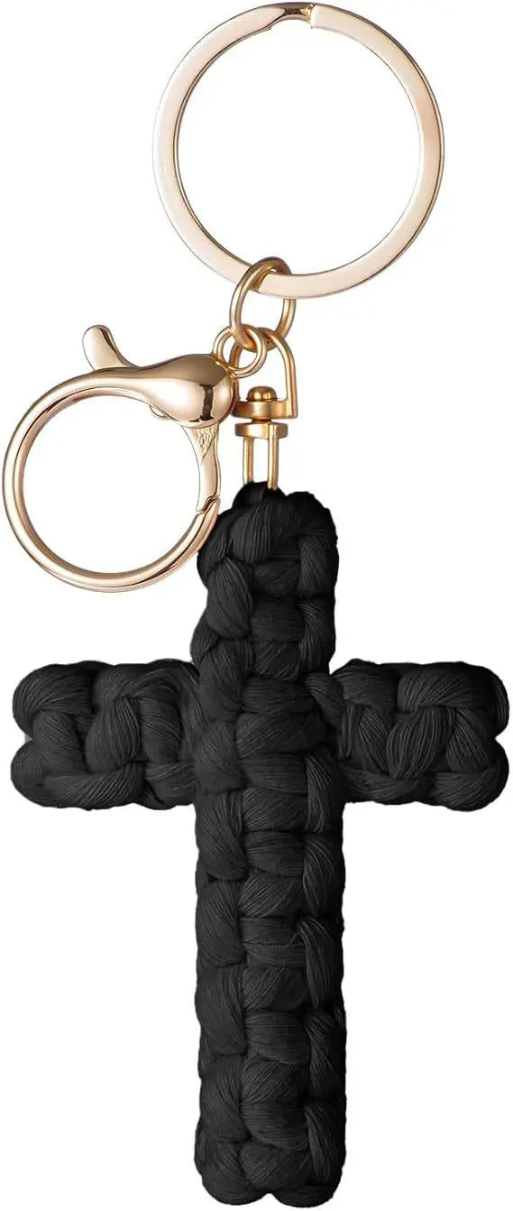 A black woven cross keychain with a gold-toned split ring and clasp.