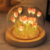 Handmade LED tulip night light featuring orange flowers inside a clear glass dome on a wooden base