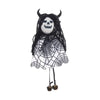 A black and white scarecrow witch ornament featuring a skull face and netting.