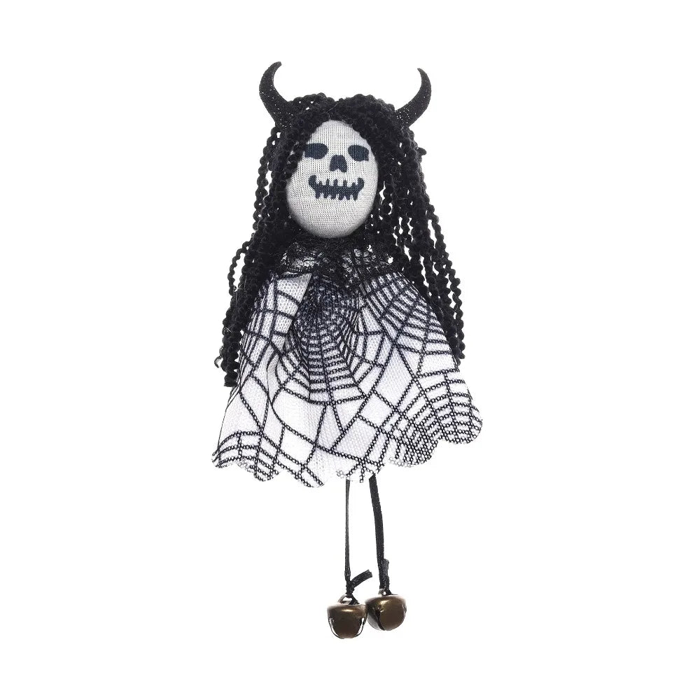 A black and white scarecrow witch ornament featuring a skull face and netting.