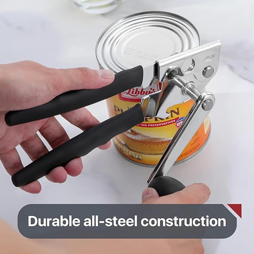 A hand is holding a silver and black manual can opener, demonstrating its durable all-steel construction.