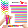 A hand is stretching a colorful noodle fidget toy set, showing various bright colored strands.