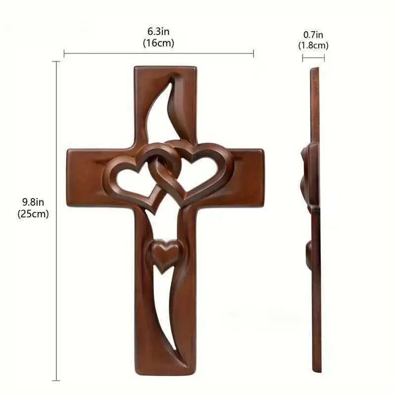 A rustic wooden wall cross with intertwined heart designs.