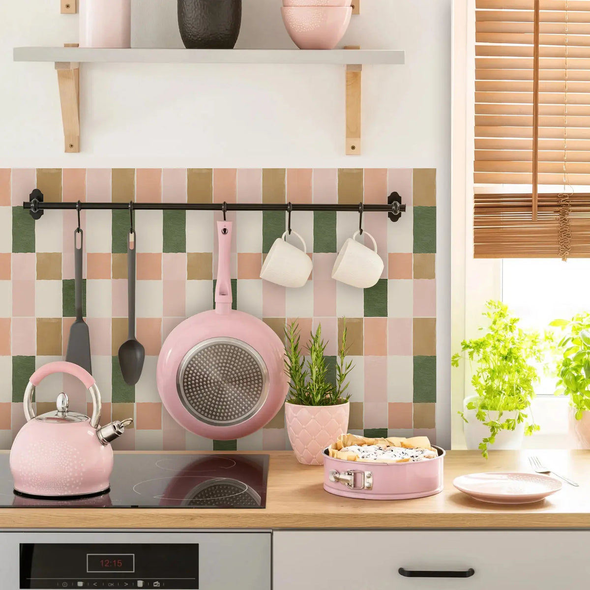 A pink and green peel-and-stick vinyl tile backsplash is displayed above a kitchen countertop.